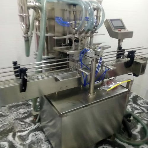 Automatic 4 Nozzle Liquid Filling Machine